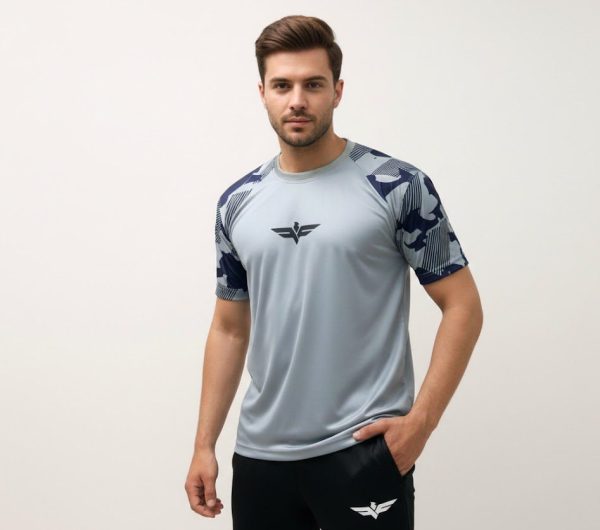 Model wearing Falcon’s Performance Tee in camouflage grey. Lightweight, breathable half-sleeve fit suitable for training, running, and athletic activities
