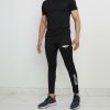unnamed (19) Model wearing Falcon’s Apex Summer Trousers in black. Lightweight breathable fit with ergonomic design suitable for training, running, and athletic activities