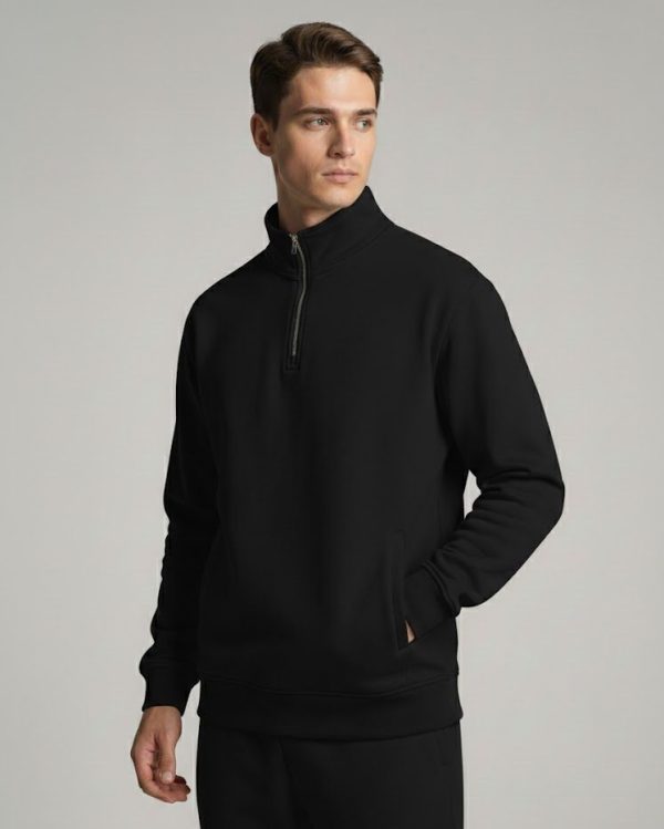 Model wearing a Black Frontier Falcon quarter-zip sweatshirt with a clean, minimalist design.