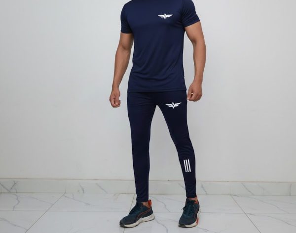 unnamed (25) Model wearing Falcon’s Apex Summer Trousers in blue. Lightweight, breathable fit with ergonomic design suitable for training, running, and athletic activities.