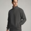 unnamed (3) Model wearing a Charcoal Frontier Falcon quarter-zip sweatshirt with a clean, minimalist design.
