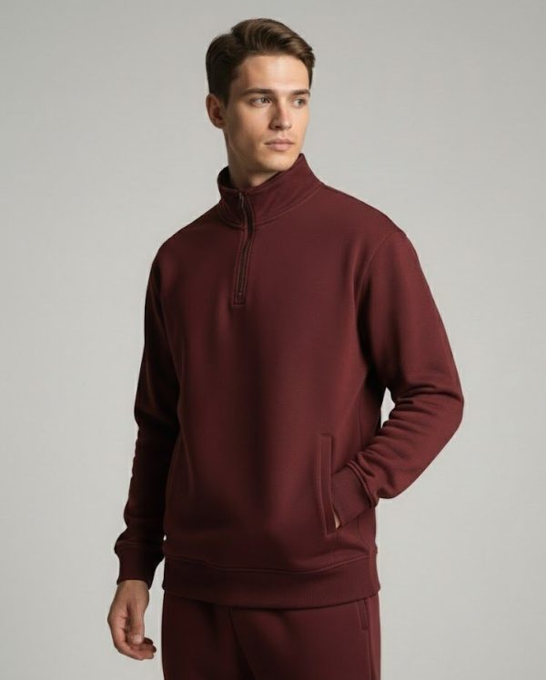 Model wearing a Maroon Frontier Falcon quarter-zip sweatshirt with a clean, minimalist design.